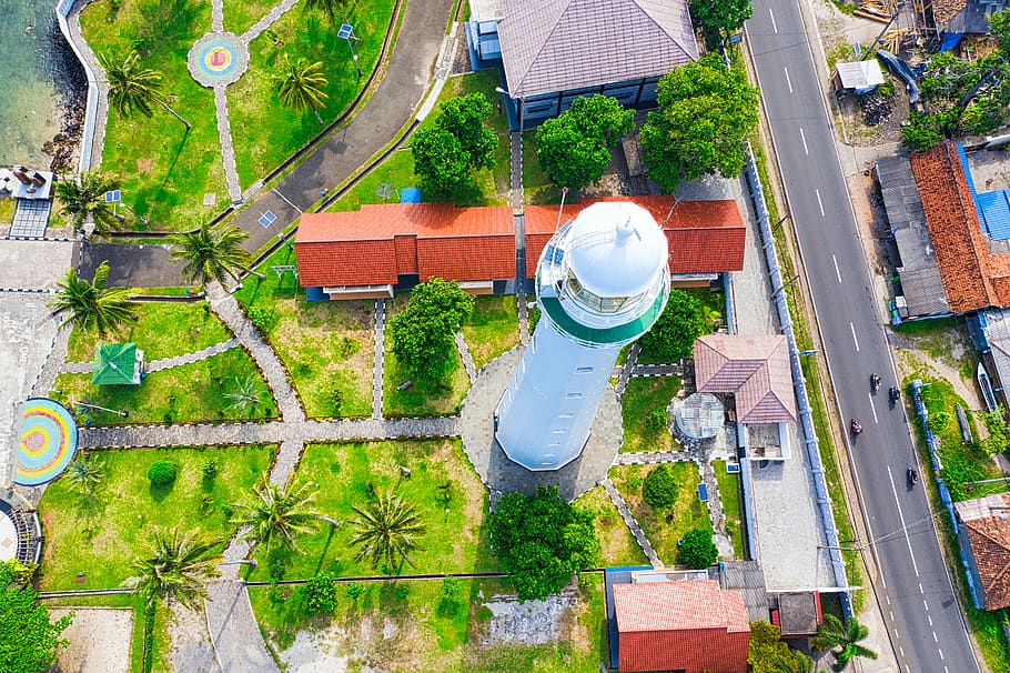 Aerial Photography of White Lighthouse Near Multicolored Houses and Green Field View, HD wallpaper