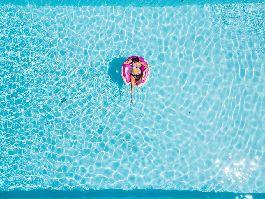 aerial photography of woman on pink swimming floats, view, sunset, HD wallpaper