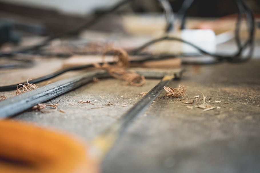 Wood Chips on Top of Gray Hacksaw, blur, desk, dirty, indoors, HD wallpaper
