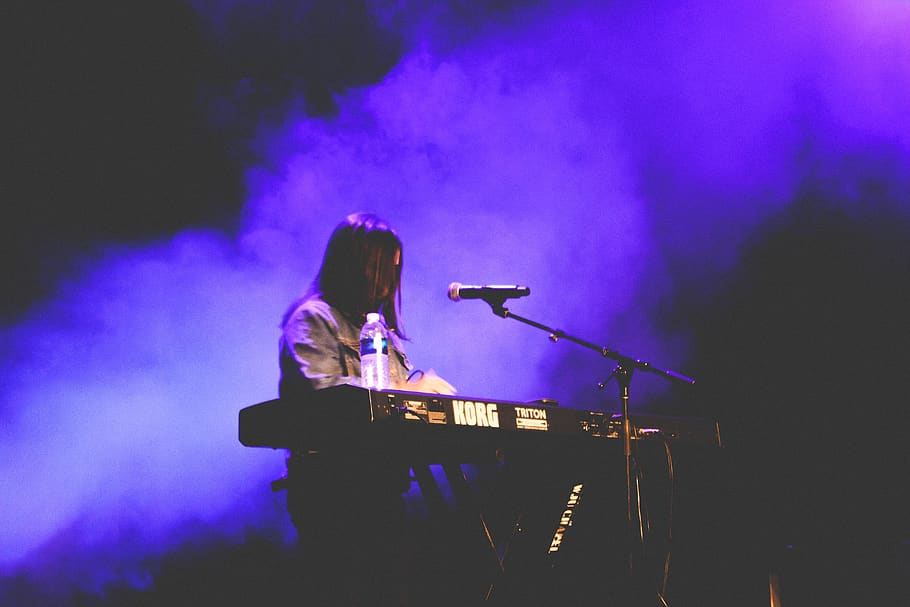 woman playing electronic keyboard, person, human, musician, lighting
