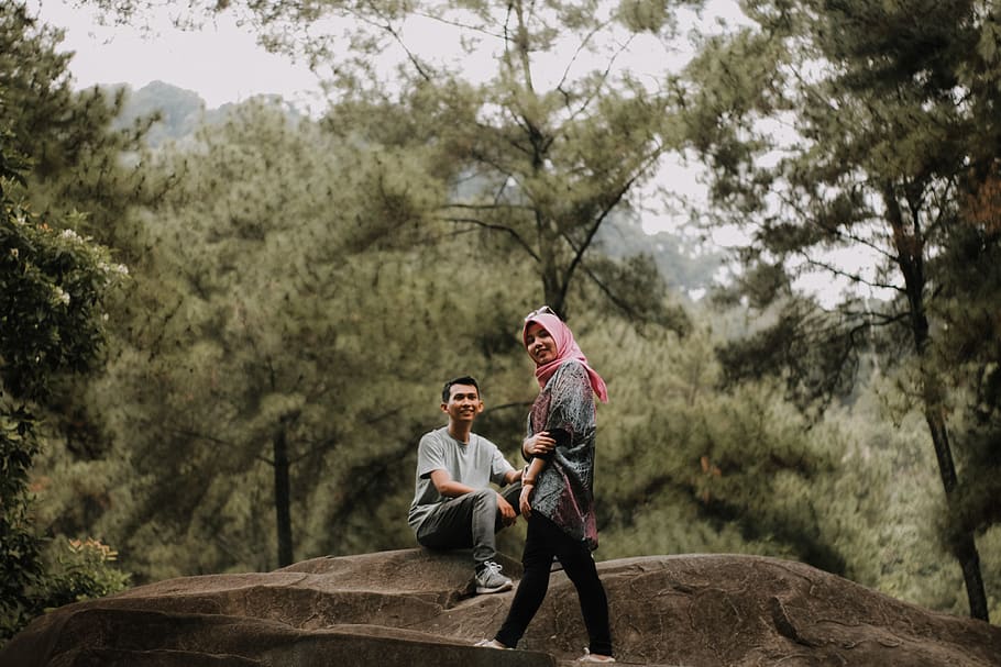 Man And Woman Sitting On Stone , daylight, environment, people HD wallpaper