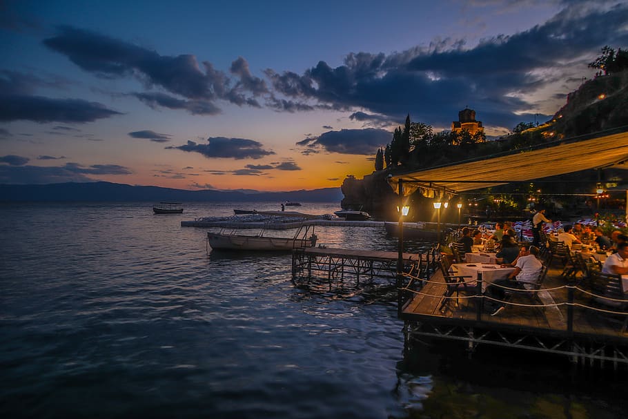 People In A Restaurant Beside Body Of Water, dawn, macedonia, HD wallpaper