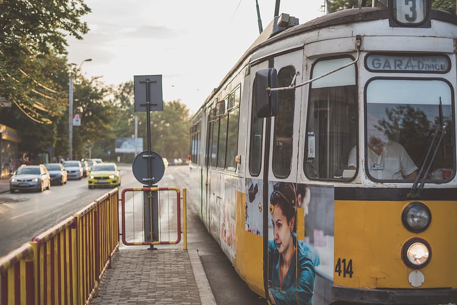 white train beside yellow steel fence, tram, human, person, people, HD wallpaper