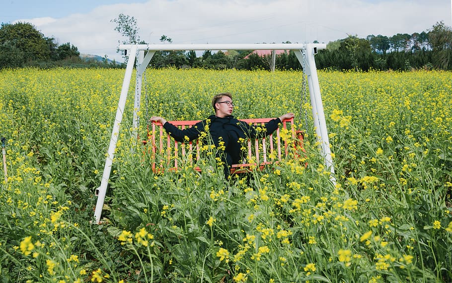 Man Sitting on White and Orange Swing Bench, crop, cropland, daylight HD wallpaper