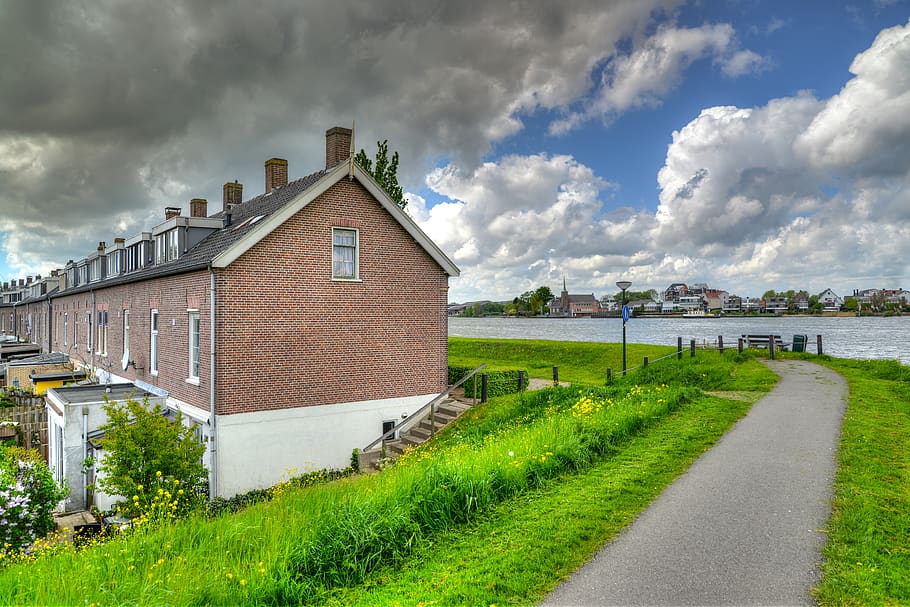 Brown House Near Body of Water, architecture, brickwalls, buildings HD wallpaper