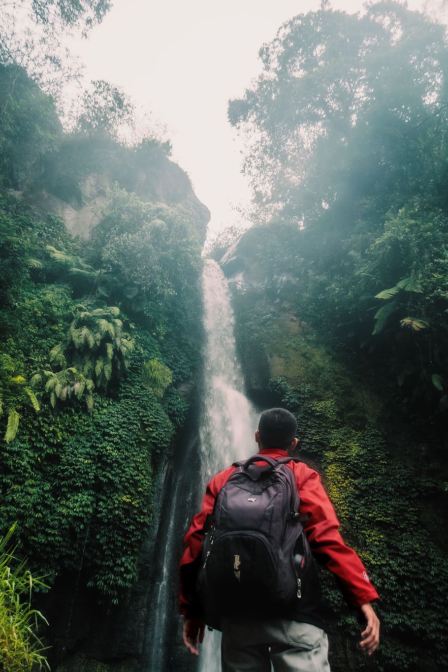Man Wearing Black Backpack Under Waterfall, daylight, environment HD wallpaper