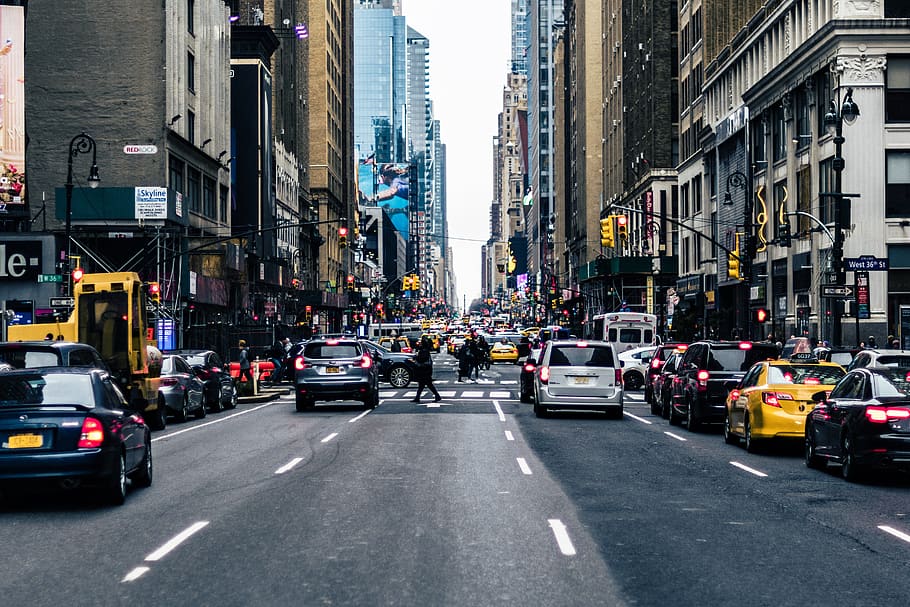 vehicles on road between buildings, city, transportation, mode of transportation HD wallpaper