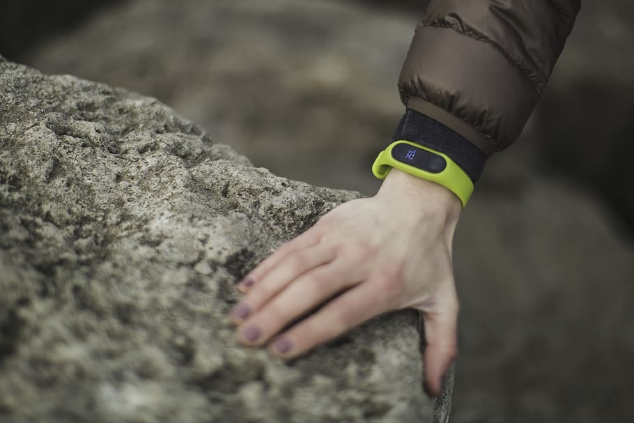 Person Wearing Yellow Fitness Band Holding Rock, environment, HD wallpaper