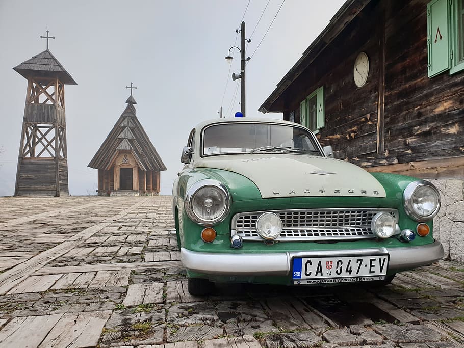 green and white vehicle near wooden buildings, architecture, built structure HD wallpaper