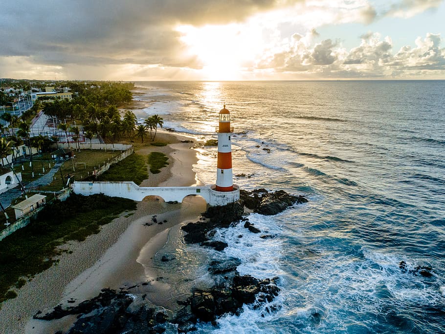 white and orange lighthouse beside sea, drone view, water, ocean HD wallpaper
