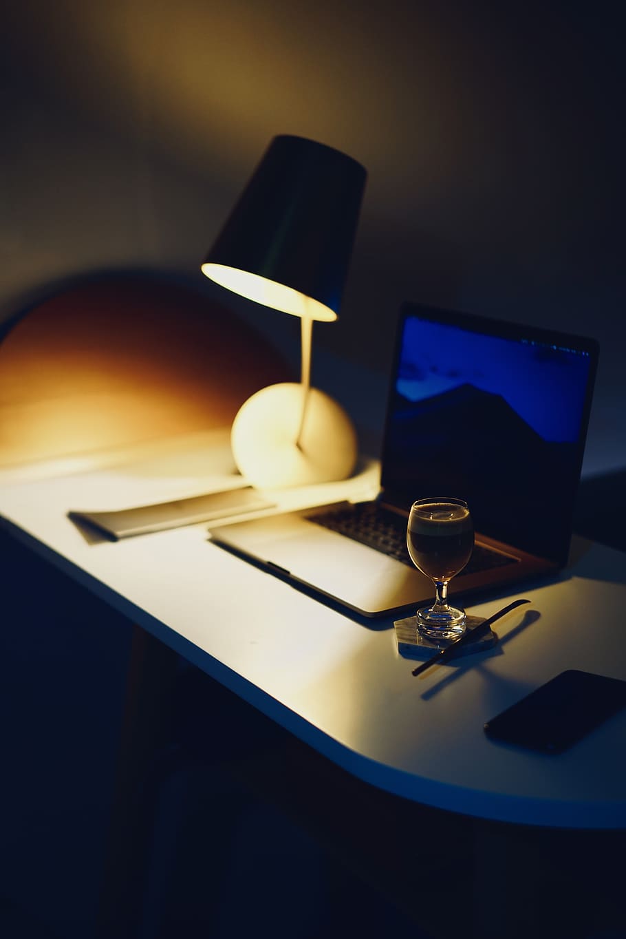 lighted desk lamp in table, indoors, still life, technology, no people