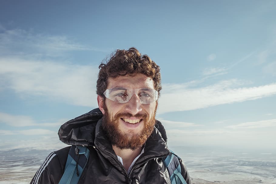 man smiling, person, human, face, apparel, clothing, outdoors HD wallpaper