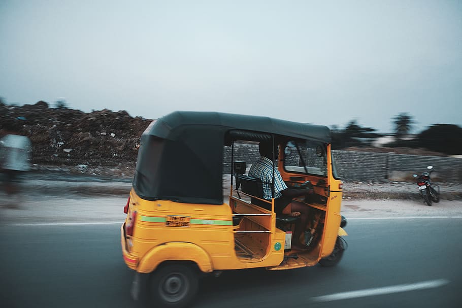 man riding auto rickshaw travelling on road, chennai, india, transportation