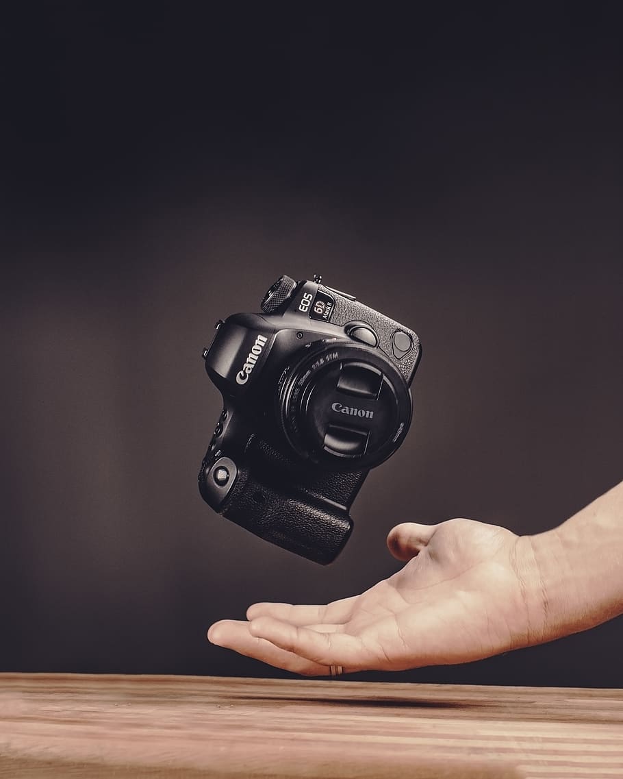 Photo of Person Catching Camera, blur, canon, close-up, dslr HD wallpaper