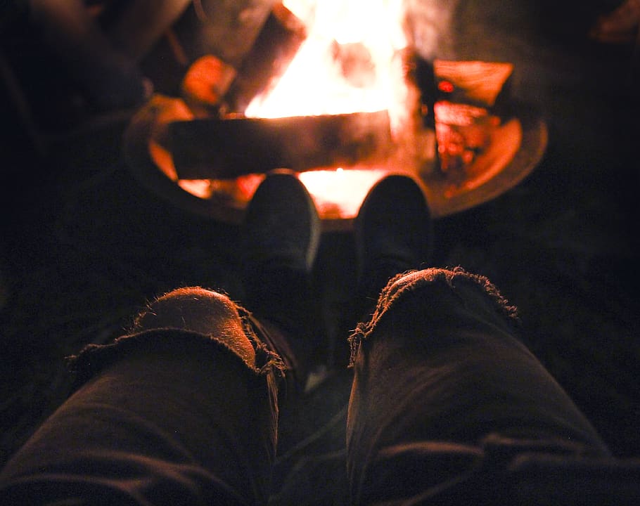 person in blue denim jeans near bonefire, apparel, clothing, flame
