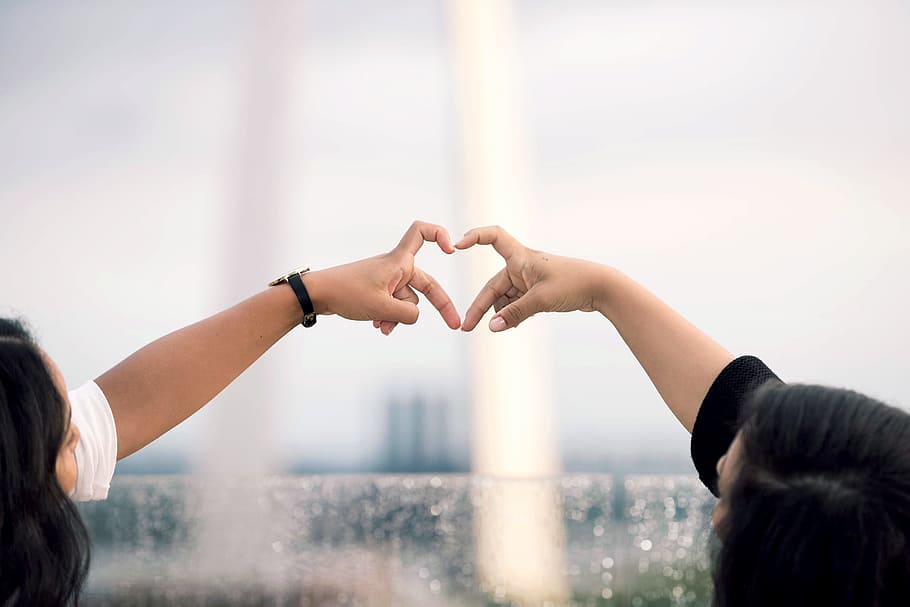 two person doing heart hand sign during daytime, friend, light