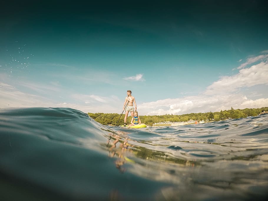 persons standing on surfboard, man, water, kid, child, family HD wallpaper