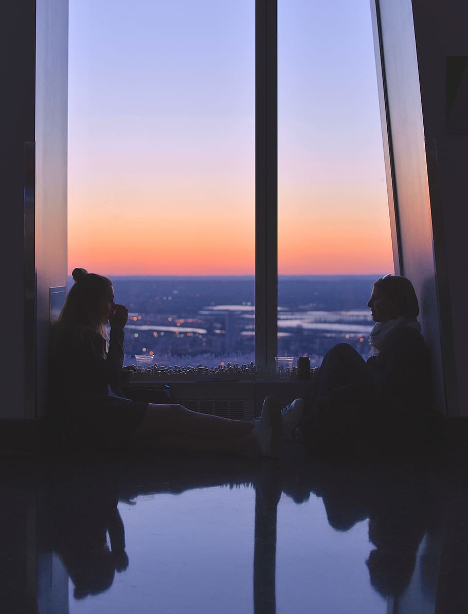 two women sitting near window, talking, view, couple, female HD wallpaper