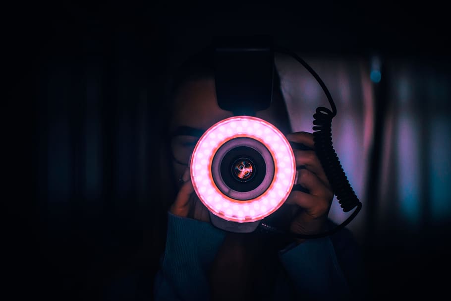 Person Holding Camera With Red Lights on Lens, art, circle, close-up HD wallpaper