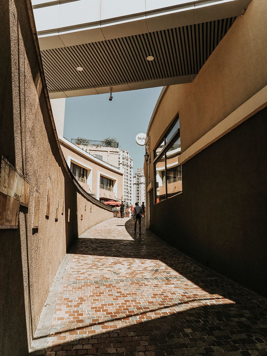 person in narrow street, building, architecture, sunlight, shadow HD wallpaper