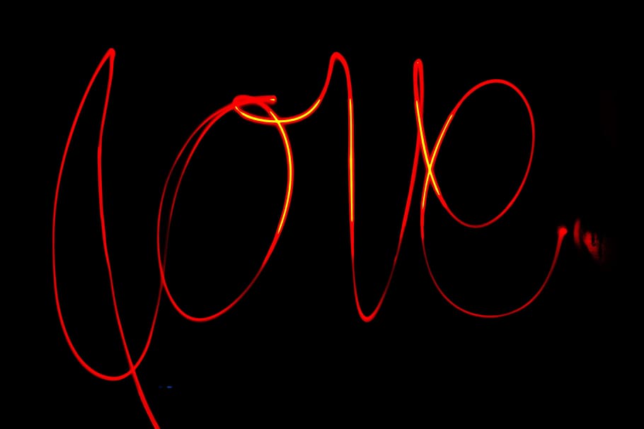 black background with love text overlay, light, red, typography