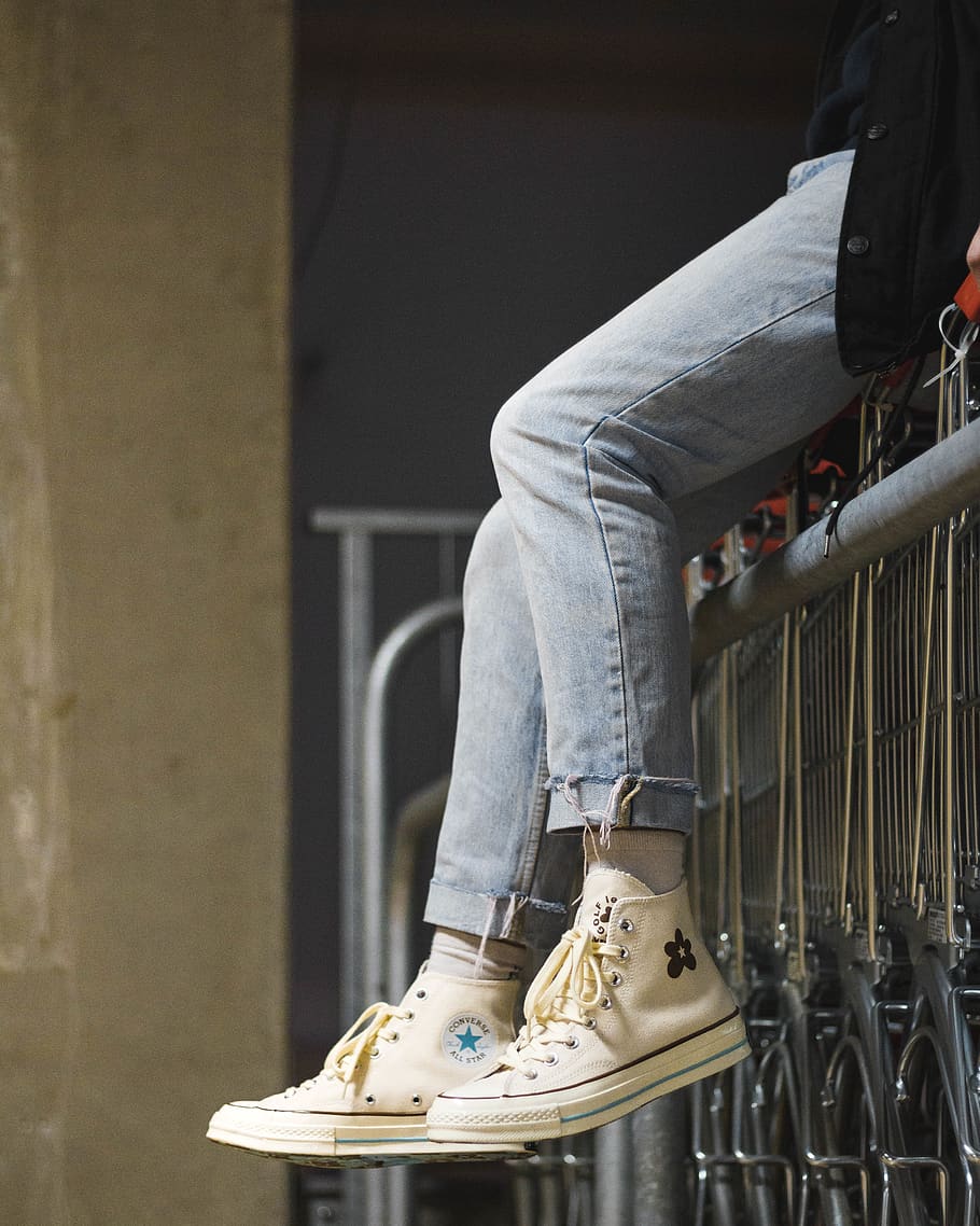 person sitting on gray gate, shoe, low section, human leg, jeans HD wallpaper