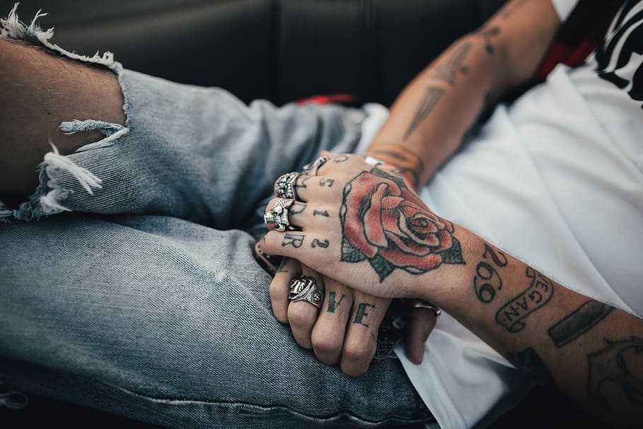 HD wallpaper: person holding man's hand, tattoo, rose, ring, grunge, skin,  ink | Wallpaper Flare