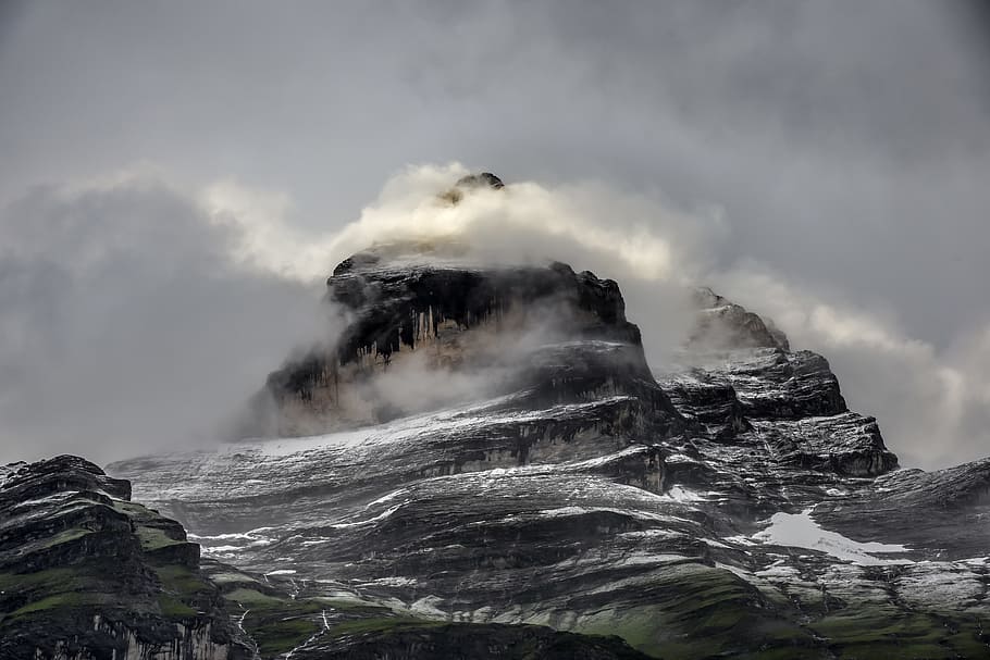 low angle photo of gray and black rugged mountain and clouds at daytime HD wallpaper
