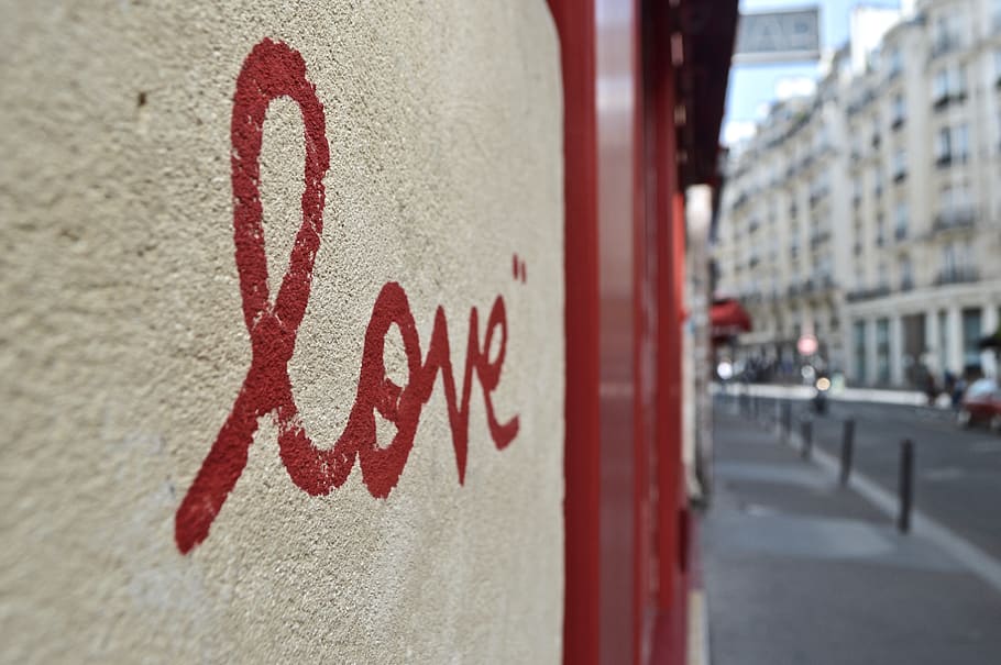 red Love print on wall, city, text, communication, focus on foreground HD wallpaper
