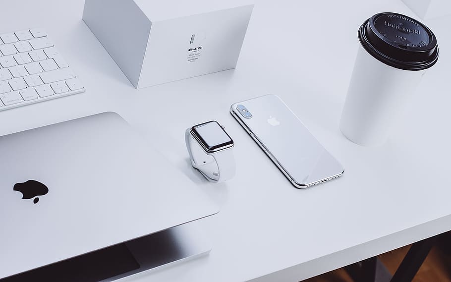 Apple products on table, macbook, coffee, desk, box, keyboard