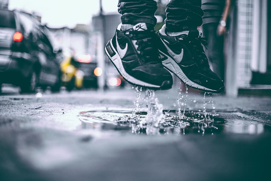 Pair of Black-and-white Nike Sneakers, after the rain, footwear