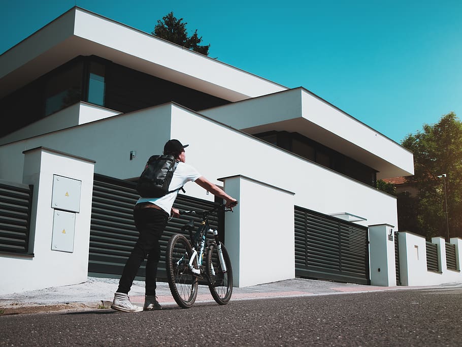 Man Holding Bike , architecture, bicycle, biker, building, facade HD wallpaper