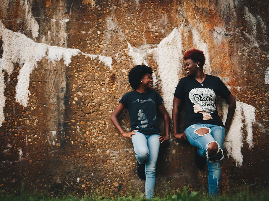 two women standing behind brown wall, black woman, african american, HD wallpaper