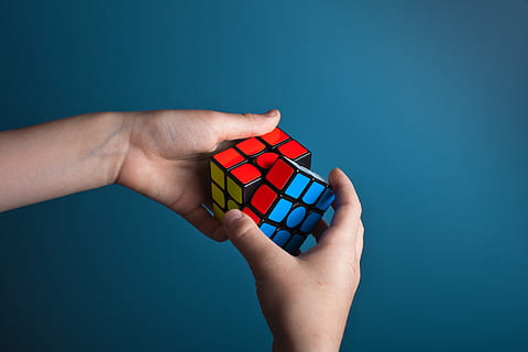 person playing magic cube, norway, bergen, finger, red cub, hands HD wallpaper