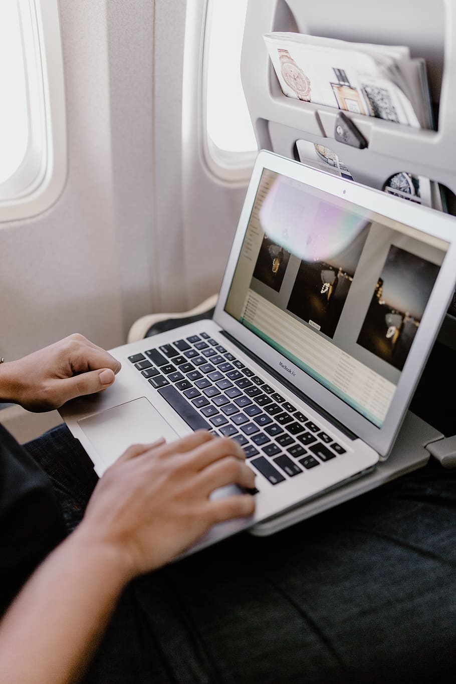 Unrecognizable man with notebook sitting inside an airplane, adult HD wallpaper