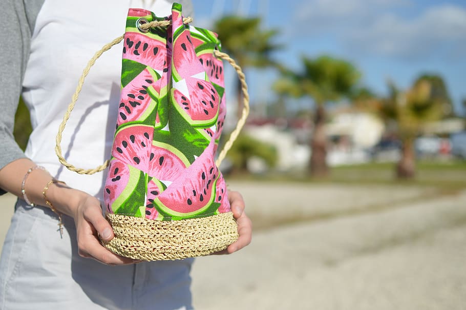 pink and green water melon-printed bag, focus on foreground, one person, HD wallpaper