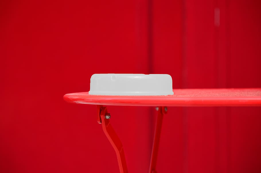 round-white-plastic-container-on-red-tab