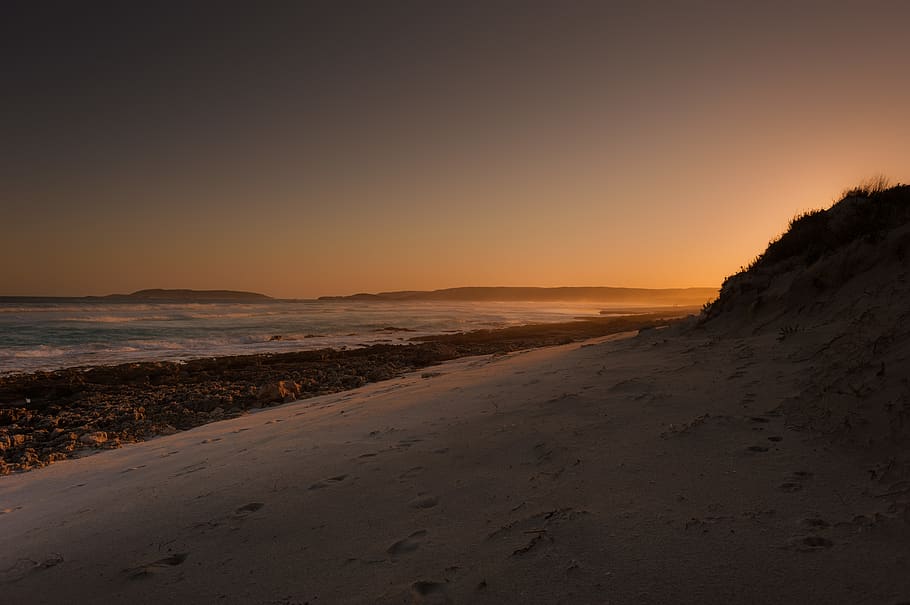 silhouette of hill near body of water, australia, sunset, twilight beach rd