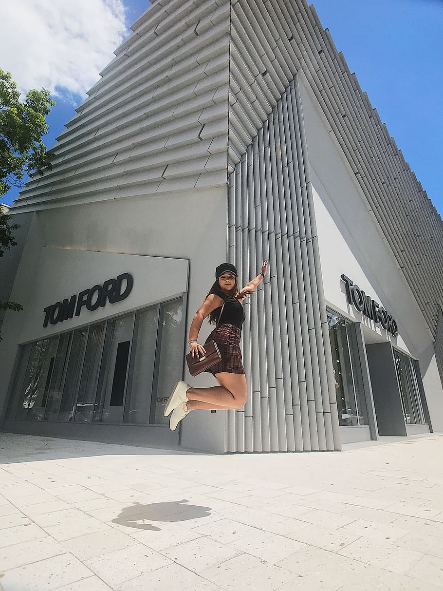 HD wallpaper: jumping woman near Tom Ford building during daytime, built  structure | Wallpaper Flare