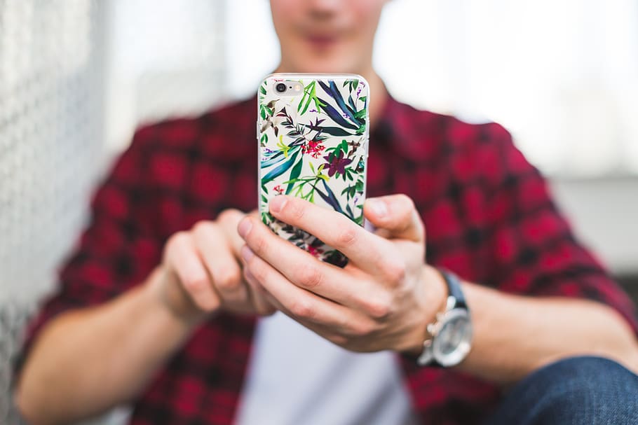 Person Holding Multicolored Floral Iphone Case, colourful, device HD wallpaper