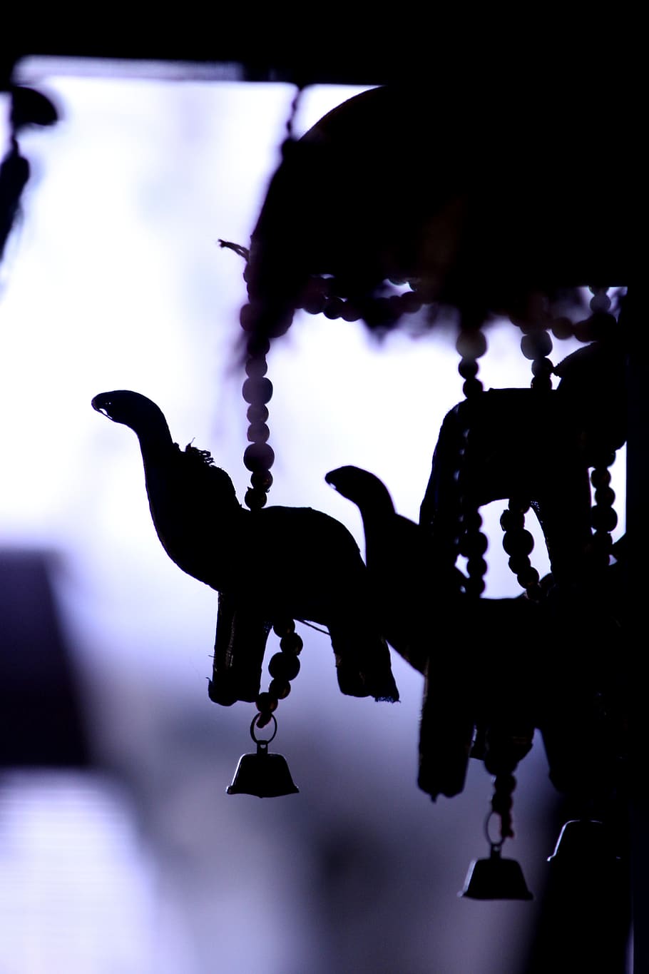 Silhouette Of Hanging Decors, backlit, bells, focus on foreground HD wallpaper