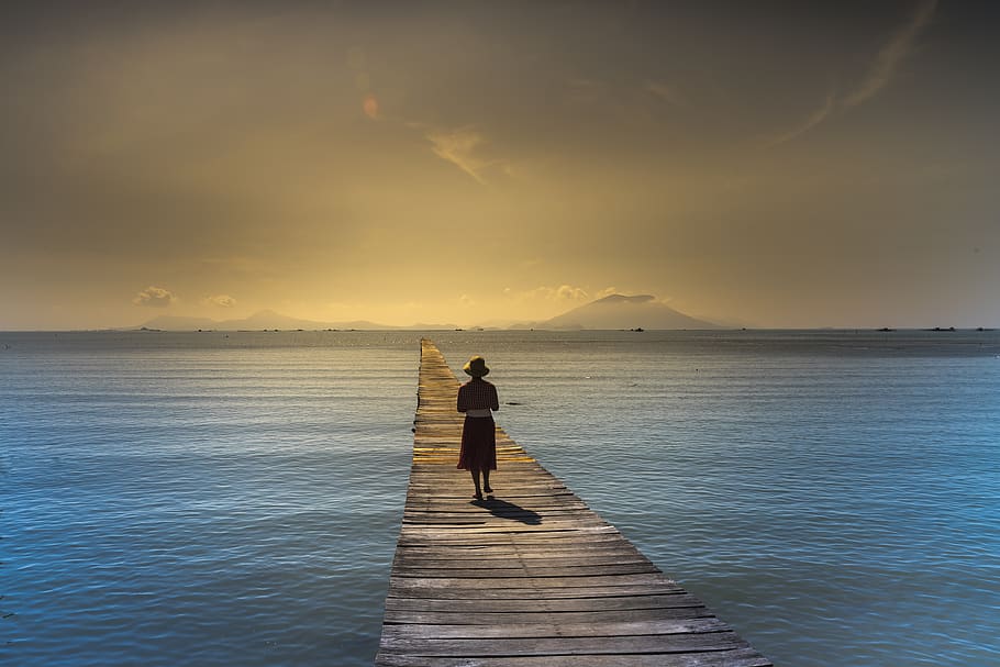Woman Wearing Bucket Hat Walking On Brown Wooden Boardwalk, dawn HD wallpaper