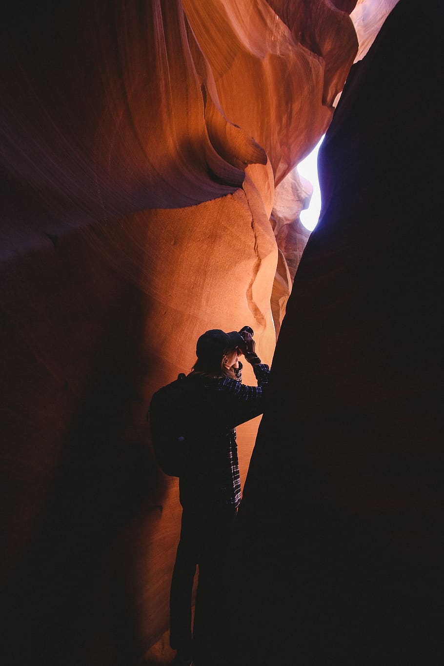 man standing inside cave, nature, human, person, sunlight, canyon HD wallpaper