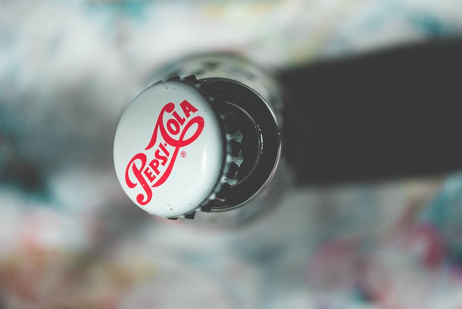 Shallow Focus Photography of Pepsi-cola Bottle Cap, above, brand
