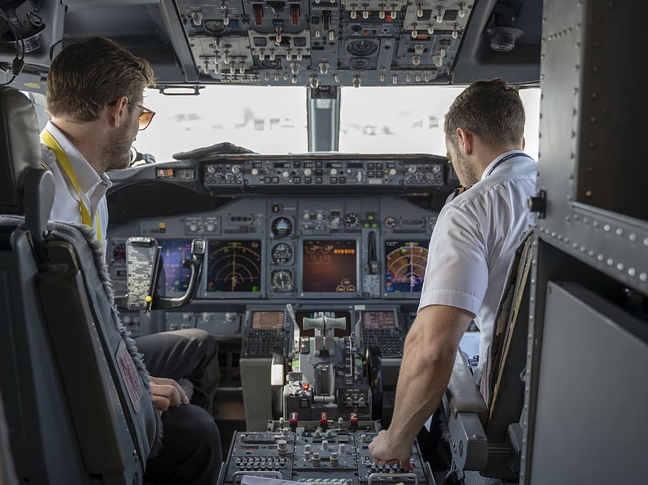 Two Pilots Sitting Inside Plane, adult, aircraft, airplane, aviate