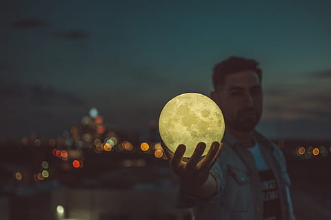 man holding moon lamp, person, human, nature, outdoors, sphere HD wallpaper