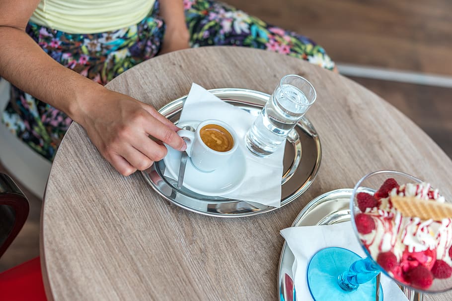 Person Sitting Beside Table While Holding Cup of Coffee, beverage HD wallpaper