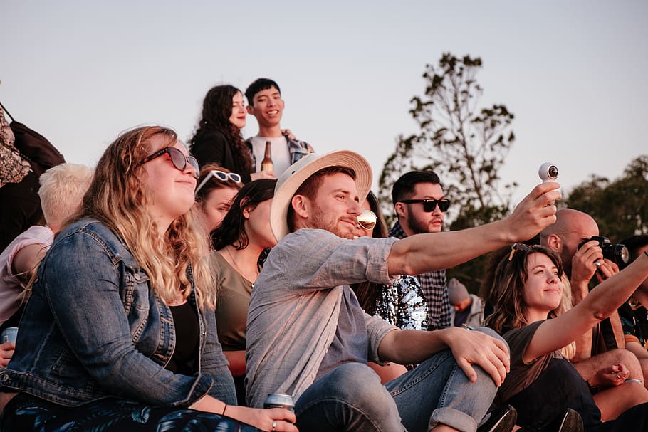 man taking selfie while sitting, group of people, young adult HD wallpaper