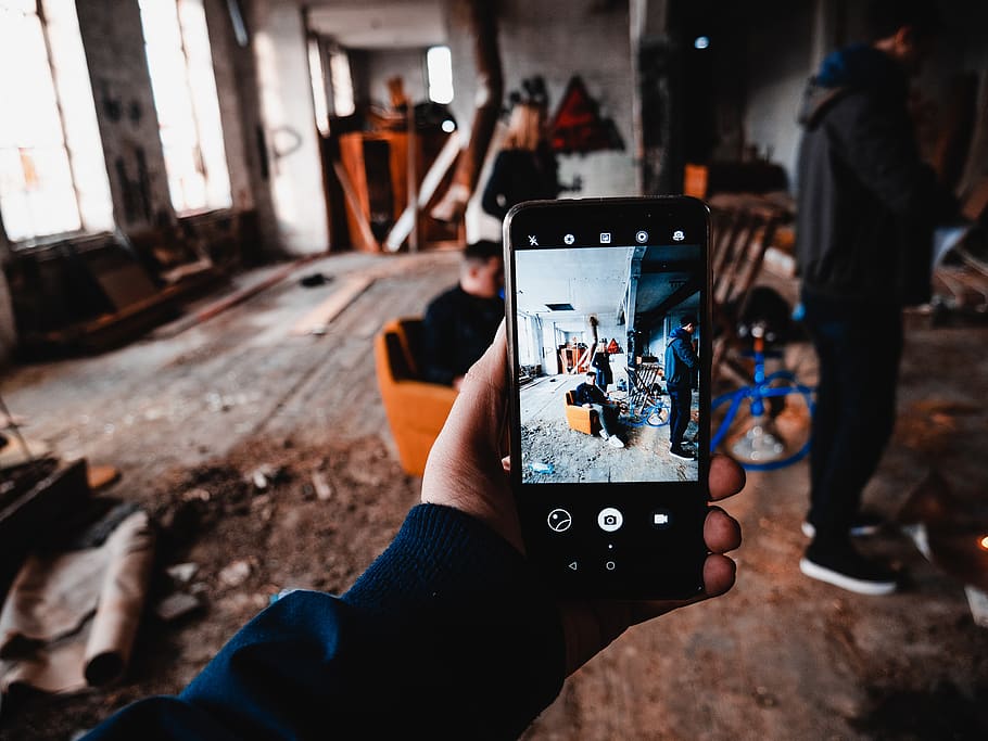 person capturing photo, human hand, technology, real people, holding HD wallpaper