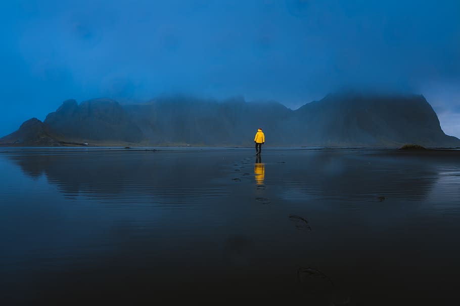 Person Standing on Body of Water Near Island, backlit, beach HD wallpaper